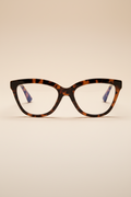 Women's blue light glasses with clear lenses and a tort frame - front view.