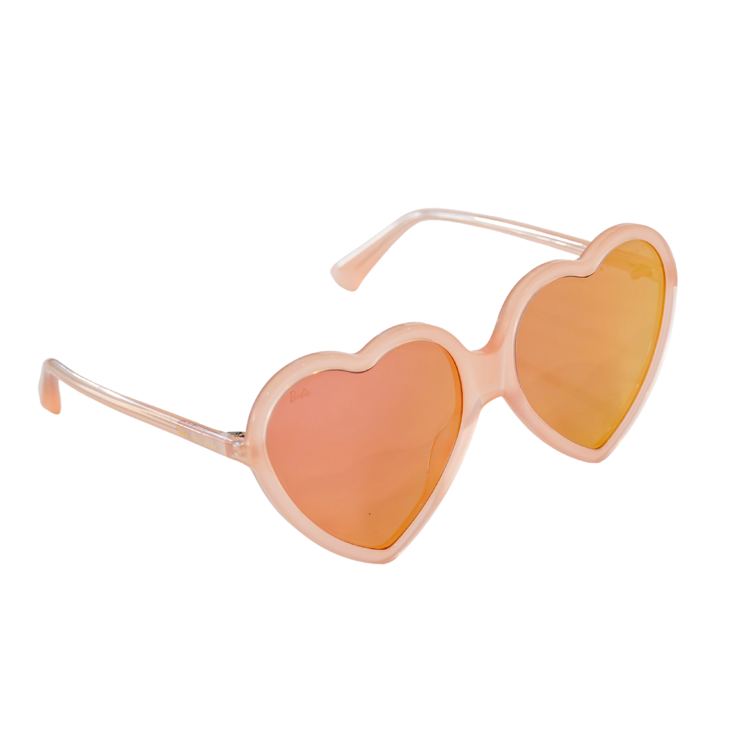 Side angle of peach-pink Barbie x Sol Kyst heart-shaped sunglasses with reflective pink-tinted lenses.