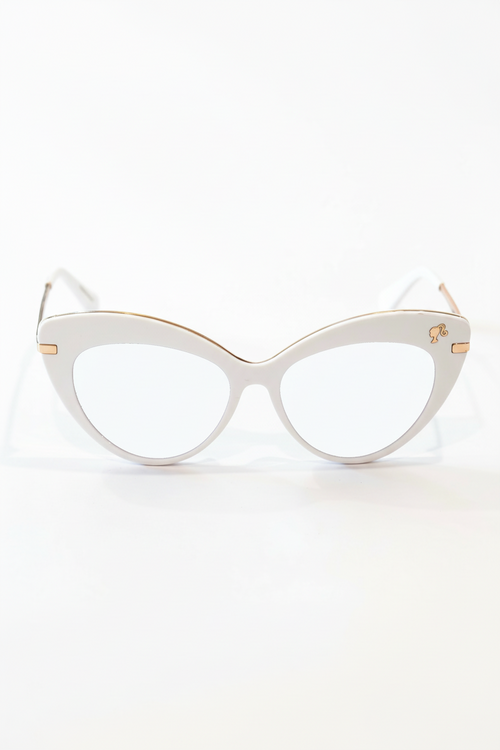 Cat-eye glasses with gold accents on a white background