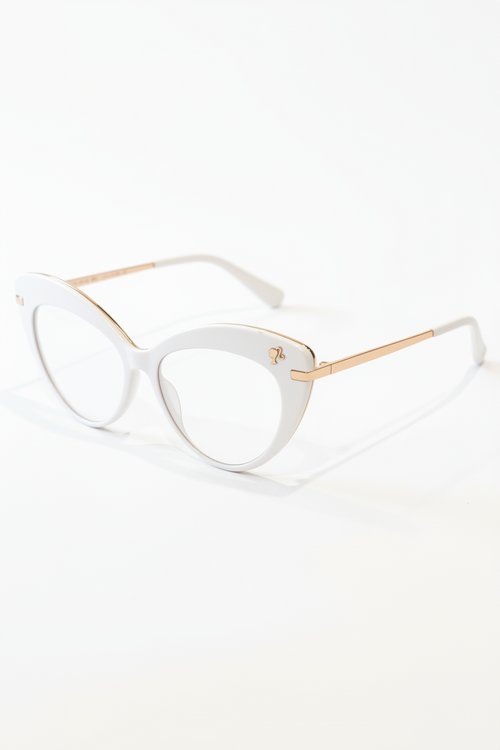 White cat-eye glasses with gold accents on a white background