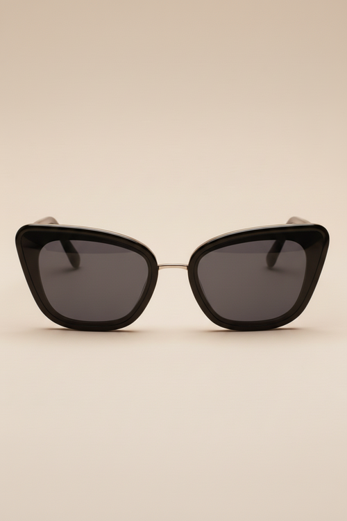 Sol Kyst women's cat eye sunglasses, with black frames and dark tinted lenses - front view.