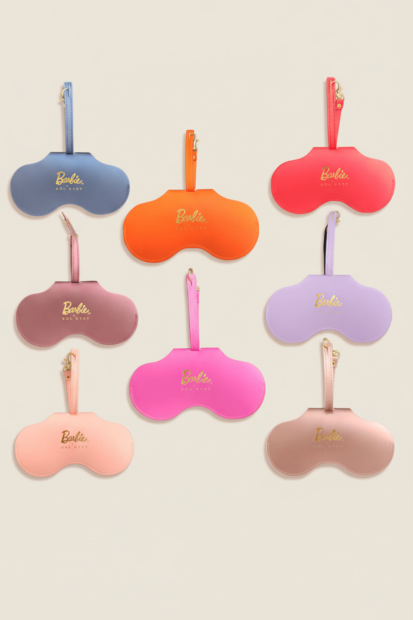 Collection of Barbie x Sol Kyst sunglasses case in various colors, including blue, orange, pink, purple, and beige.
