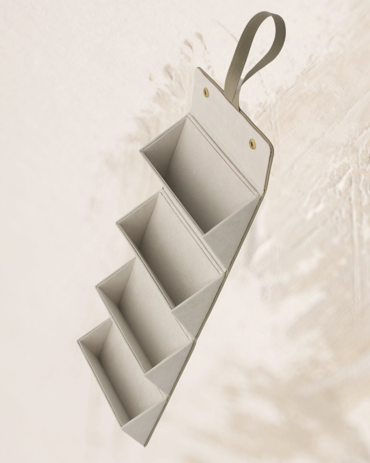 travel case for sunglasses or glasses, snap closure, strap for hanging or holding, beige leather, gold snaps - shown open, four slots for glasses, loop for hanging at the top